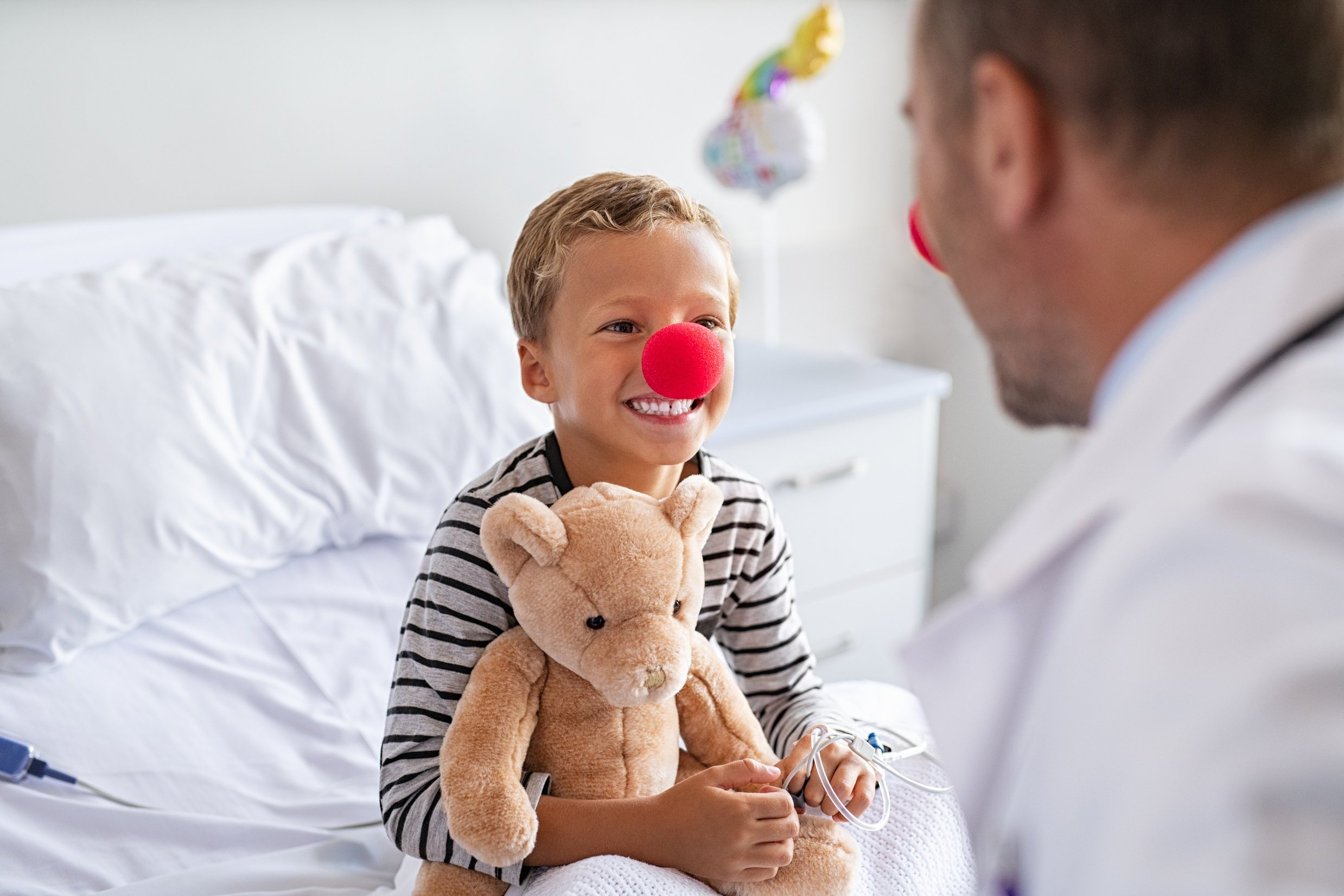 Hospitalized Child in Clown  with Doctor