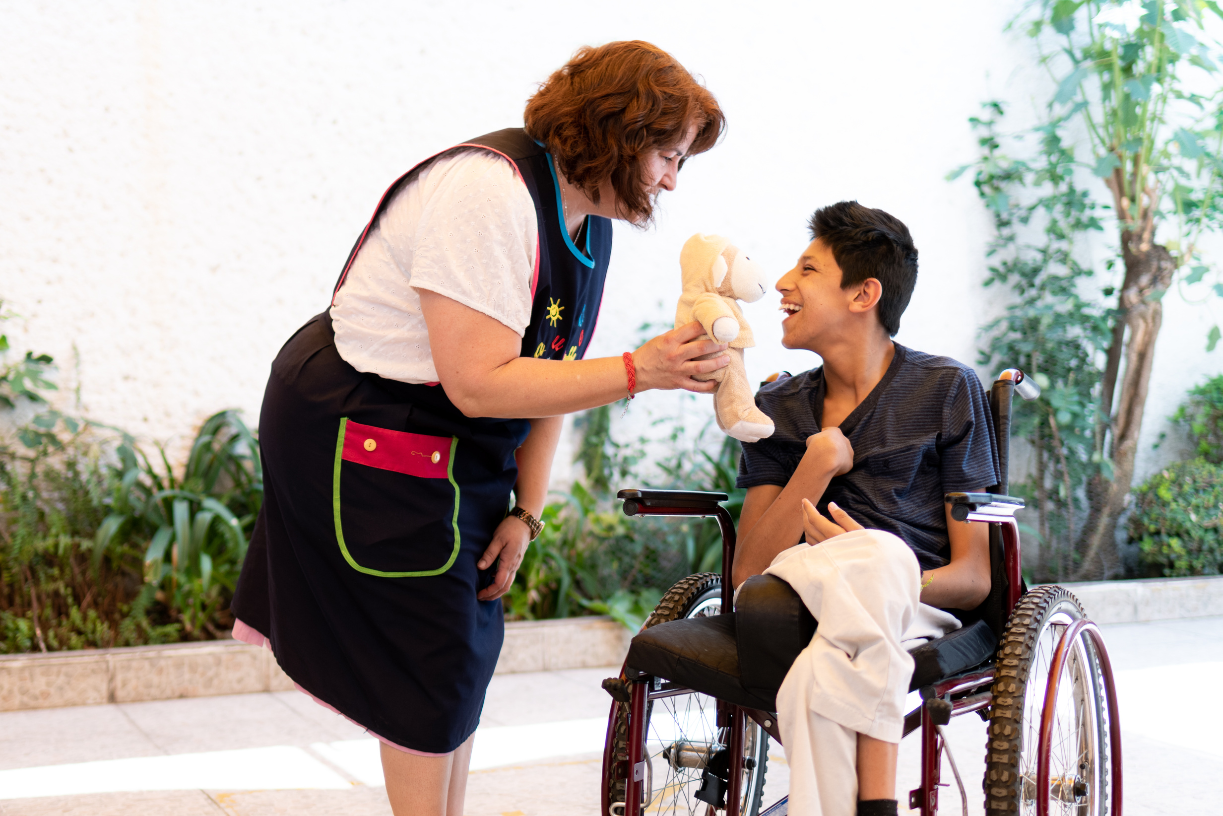 Healthcare worker helping patient with Cerebral Palsy